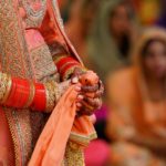 crop unrecognizable indian bride in traditional fancy gown